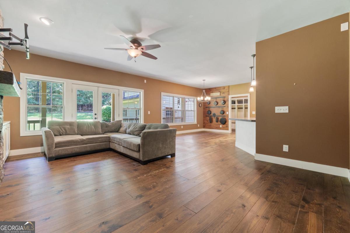 1991 Armour Bridge Road Greensboro, GA 30642 - Photo 22 of 41 a living room with furniture and a large window