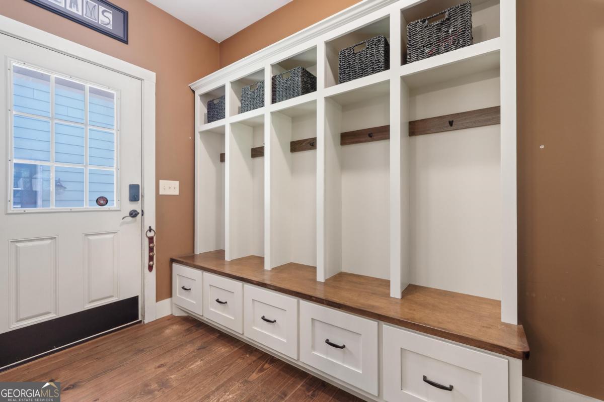1991 Armour Bridge Road Greensboro, GA 30642 - Photo 23 of 41 a view of an entryway with wooden floor and cabinet