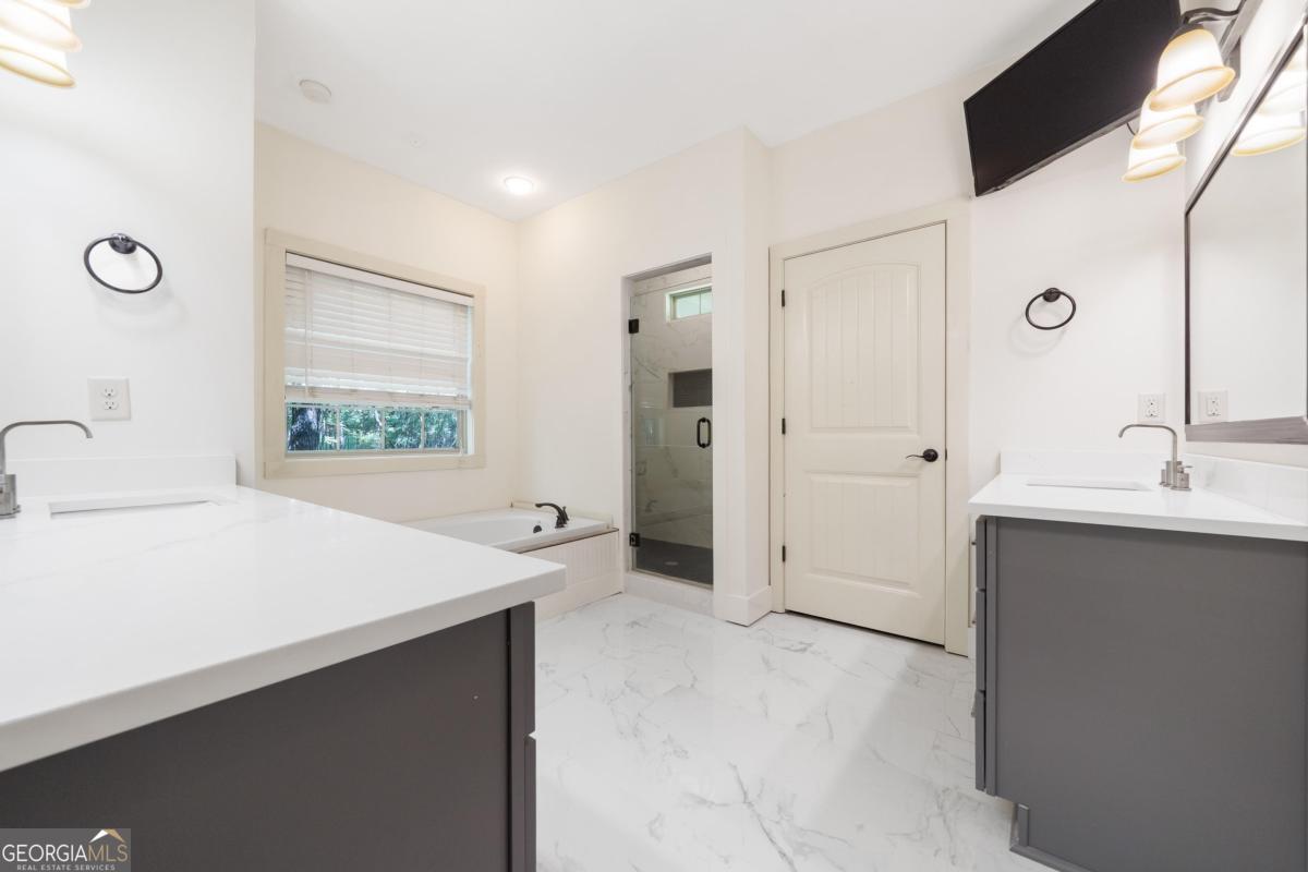 1991 Armour Bridge Road Greensboro, GA 30642 - Photo 27 of 41 a bathroom with a sink and a mirror