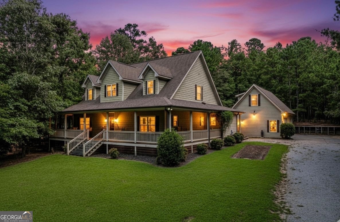 1991 Armour Bridge Road Greensboro, GA 30642 - Photo 4 of 41 a front view of a house with a garden