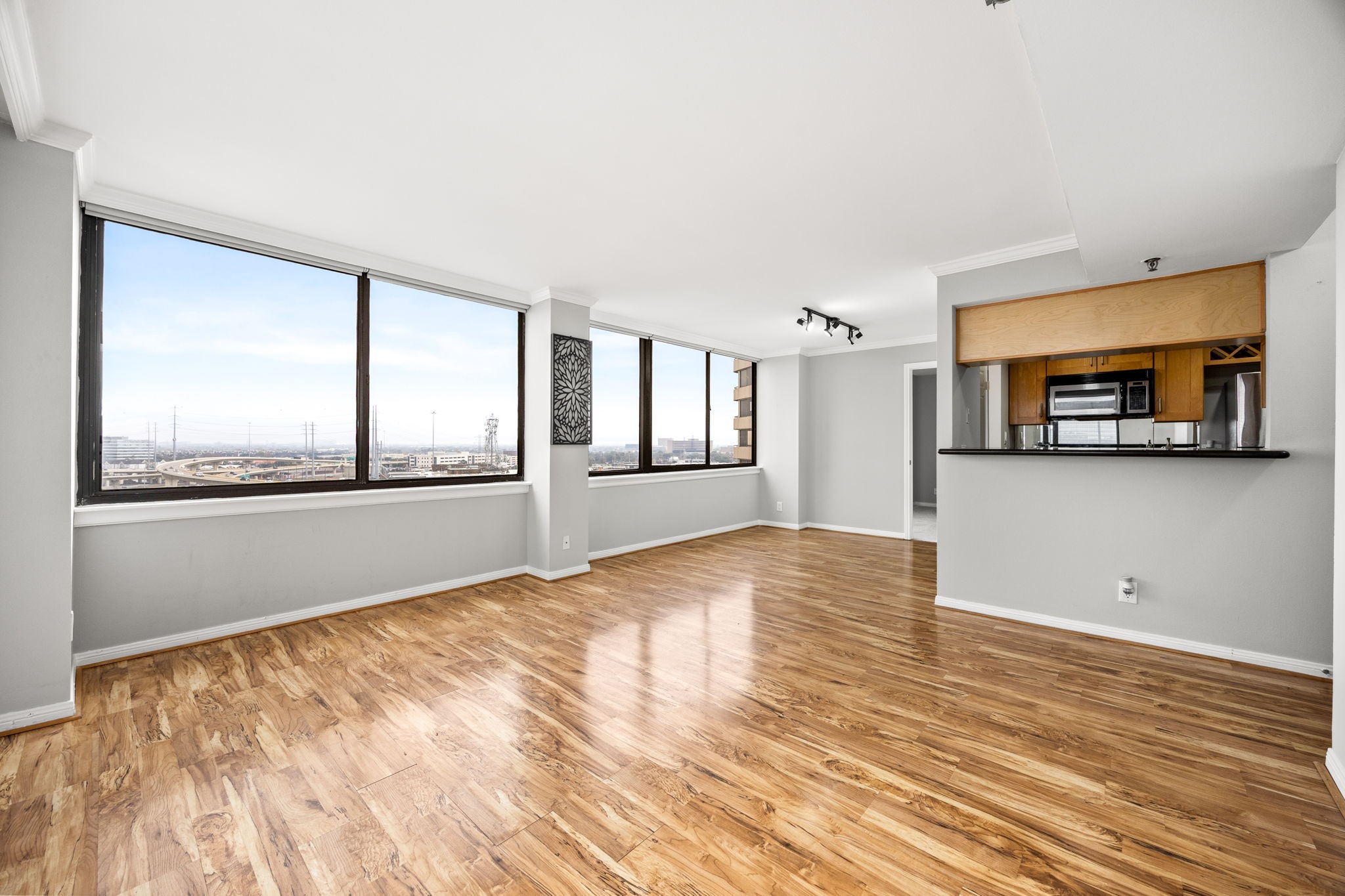 3525 Sage Road, Unit 1409 Houston, TX 77056 - Photo 20 of 45 a view of empty room with wooden floor and fan