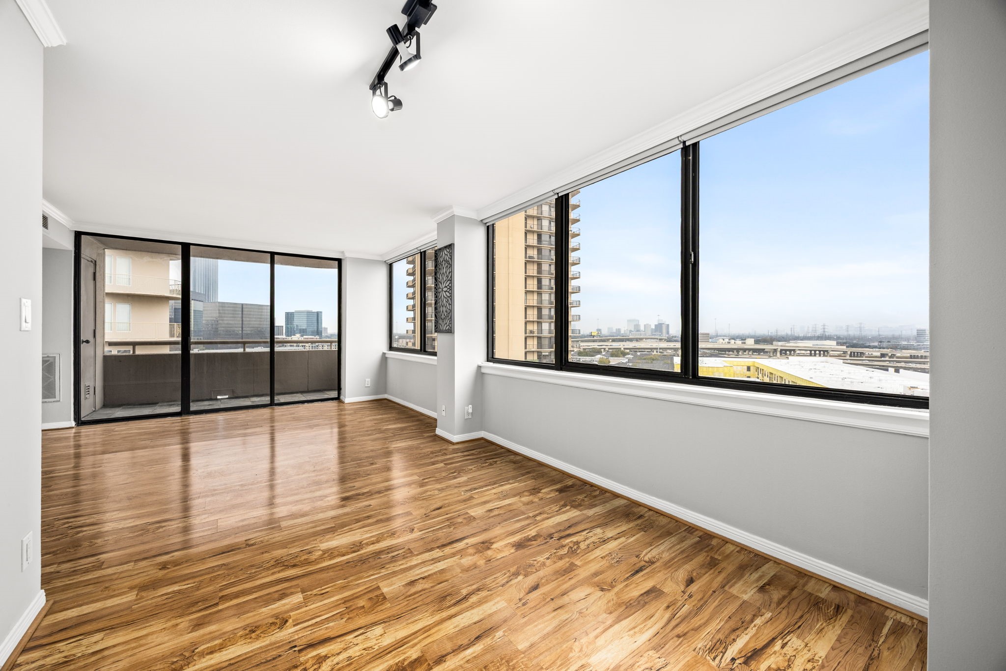 3525 Sage Road, Unit 1409 Houston, TX 77056 - Photo 24 of 45 a view of an empty room with wooden floor and a window