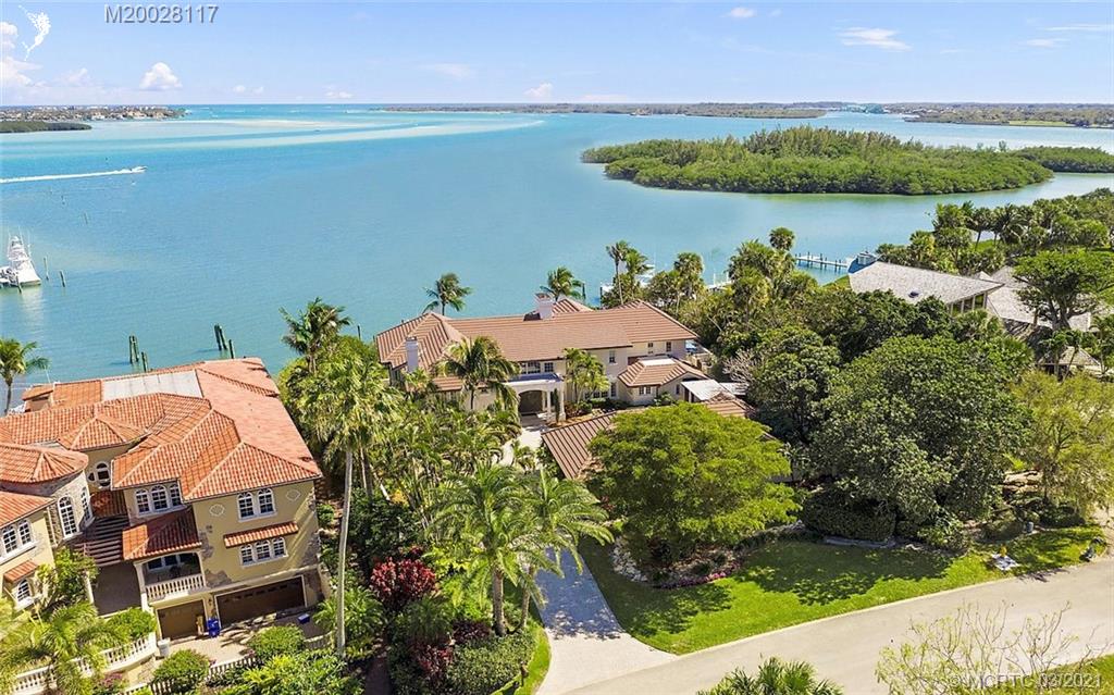 22 East High Point Road Stuart, FL 34996 - Photo 2 of 84 a aerial view of a house with a lake view
