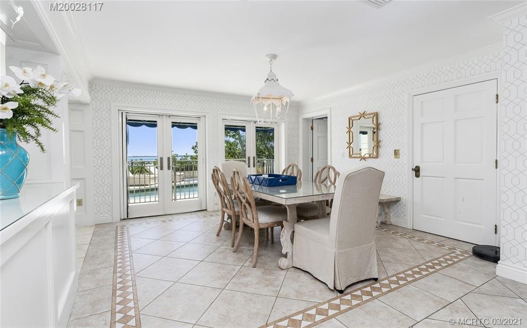 22 East High Point Road Stuart, FL 34996 - Photo 36 of 84 a view of a dining room with furniture