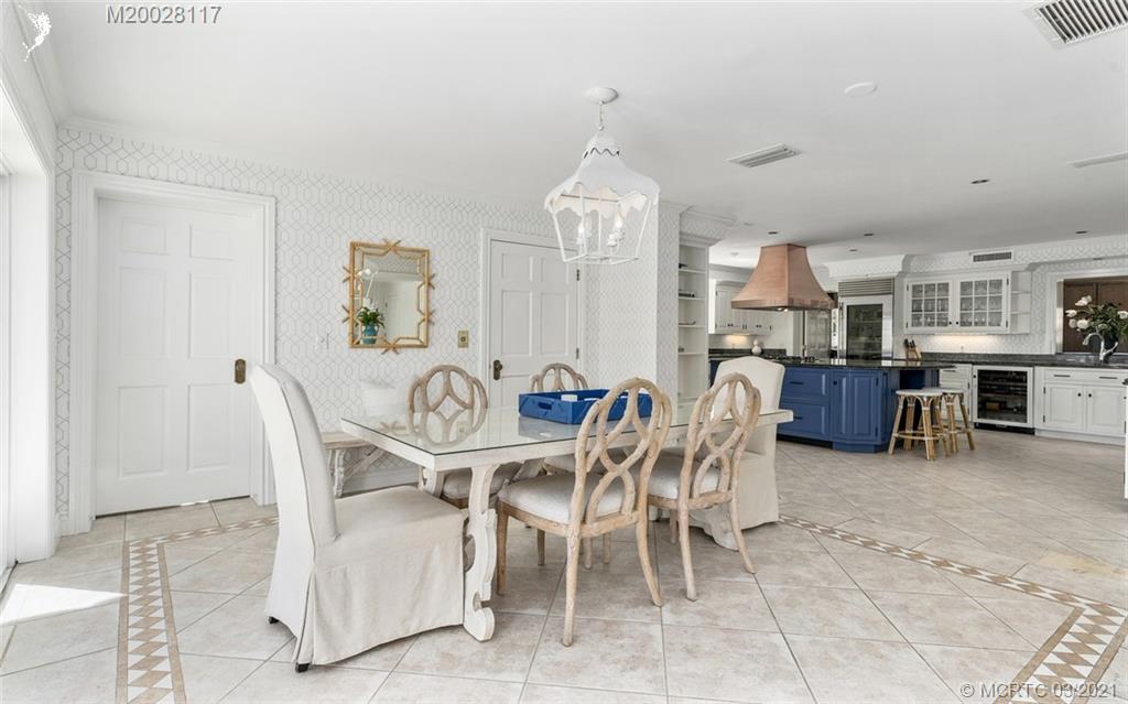 22 East High Point Road Stuart, FL 34996 - Photo 38 of 84 a view of a dining room with furniture