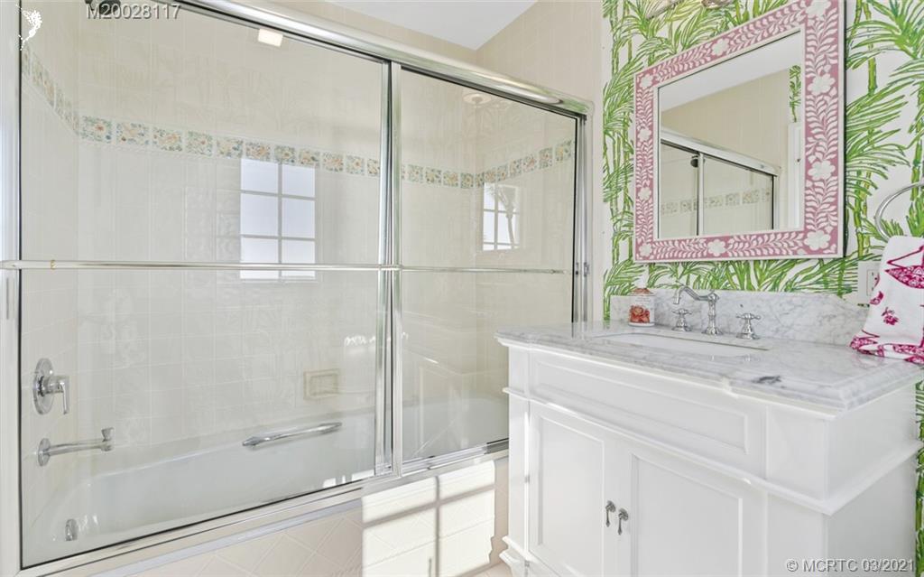22 East High Point Road Stuart, FL 34996 - Photo 61 of 84 a bathroom with a sink and a mirror