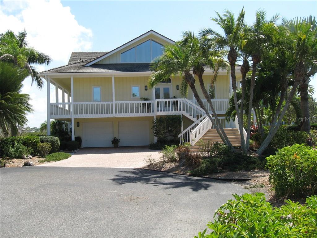 5727 Riegel's Point Road Sarasota, FL 34242 - Photo 1 of 1 a front view of a house with garden