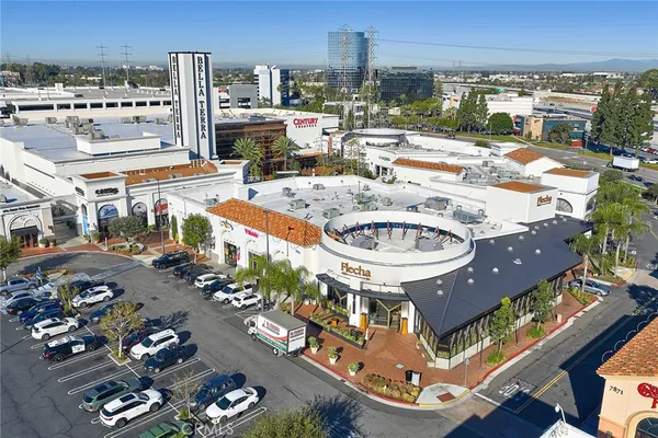 a view of city from balcony with outdoor seating