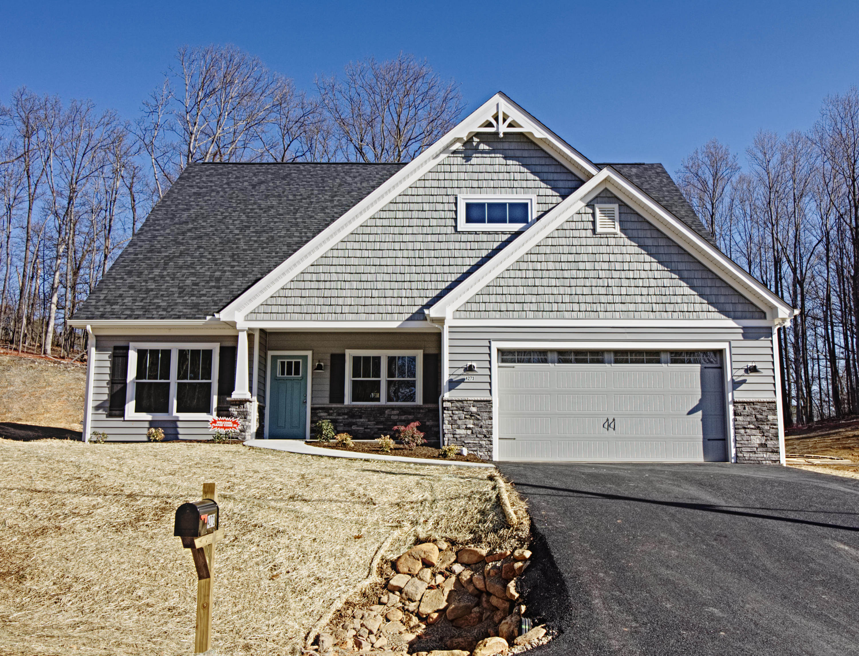 front view of a house with a yard