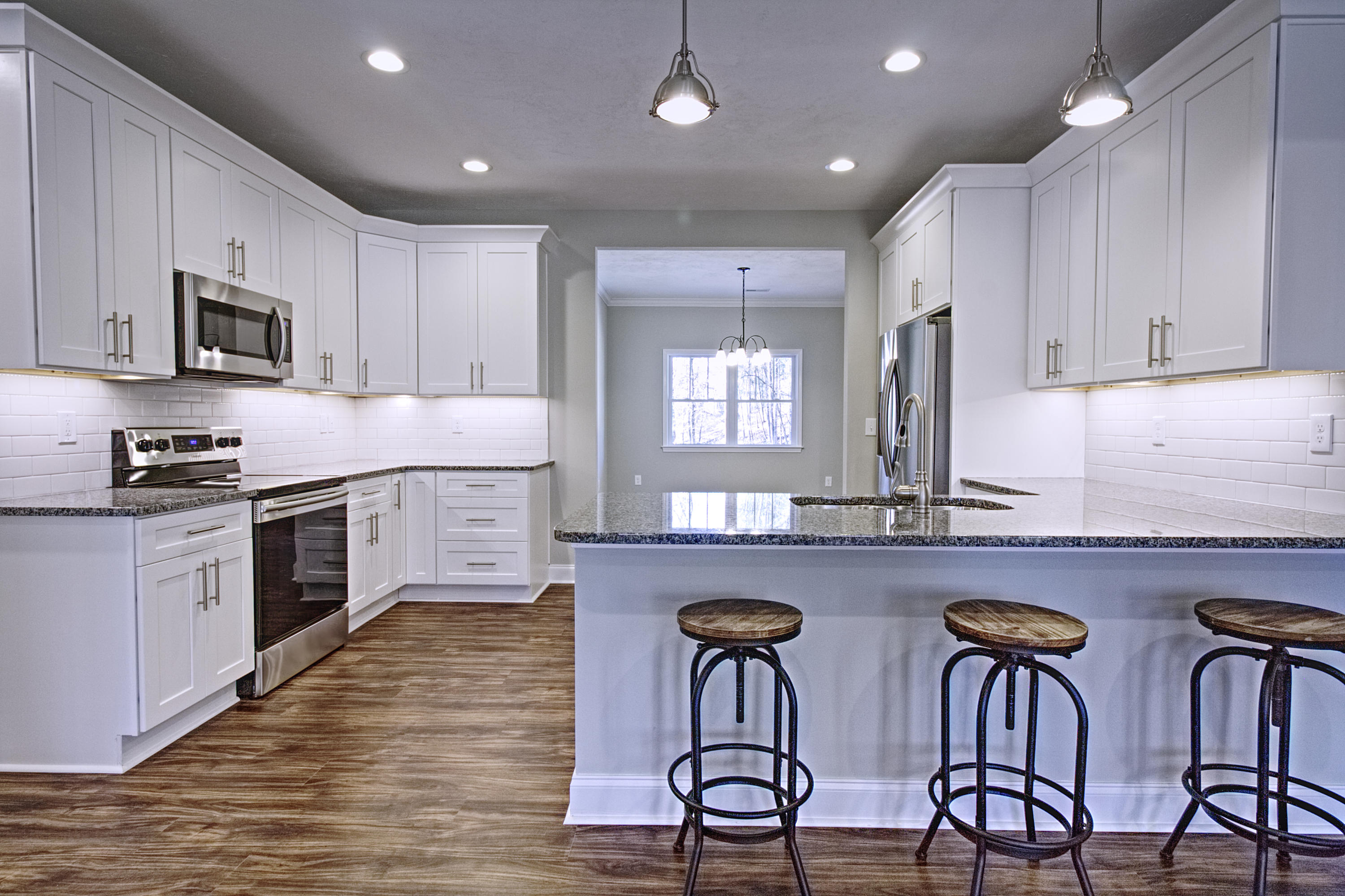 4281 Daugherty Road Salem, VA 24153 - Photo 5 of 21 a kitchen with stainless steel appliances granite countertop a table chairs sink and cabinets