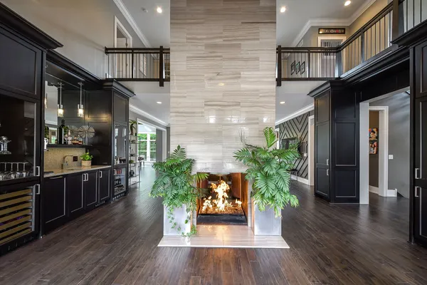 a kitchen with stainless steel appliances granite countertop lots of counter top space and wooden floors