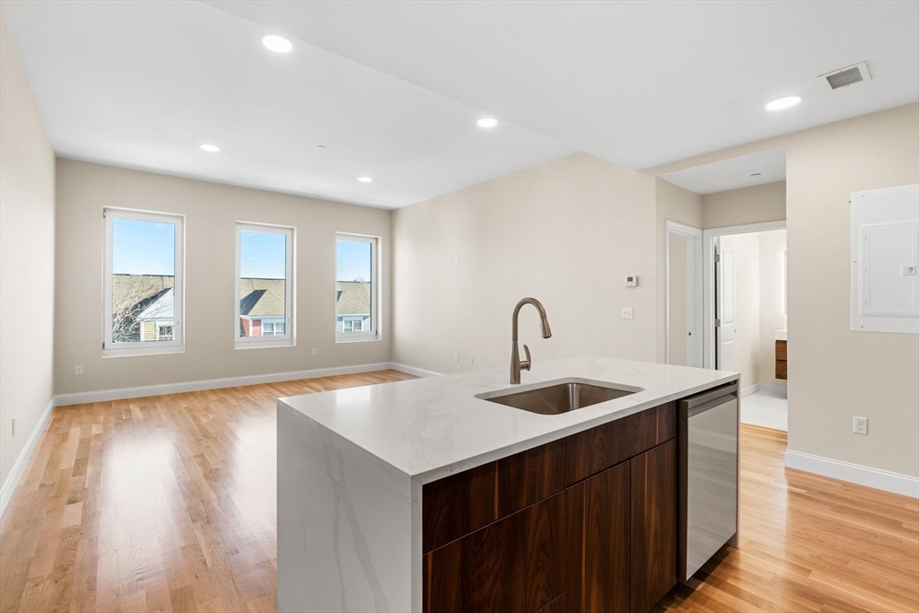 a kitchen with sink and window