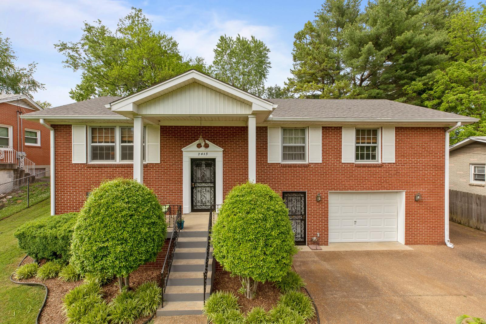 2413 Porter Road Nashville, TN 37206 - Photo 1 of 29 front view of a house with a yard