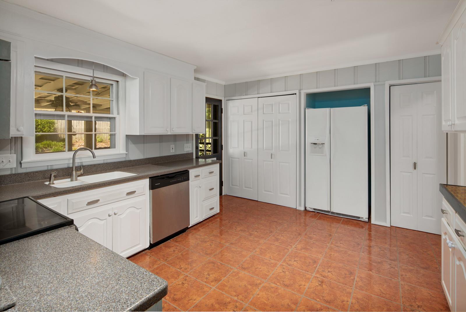 2413 Porter Road Nashville, TN 37206 - Photo 12 of 29 a kitchen with granite countertop a sink and a stove