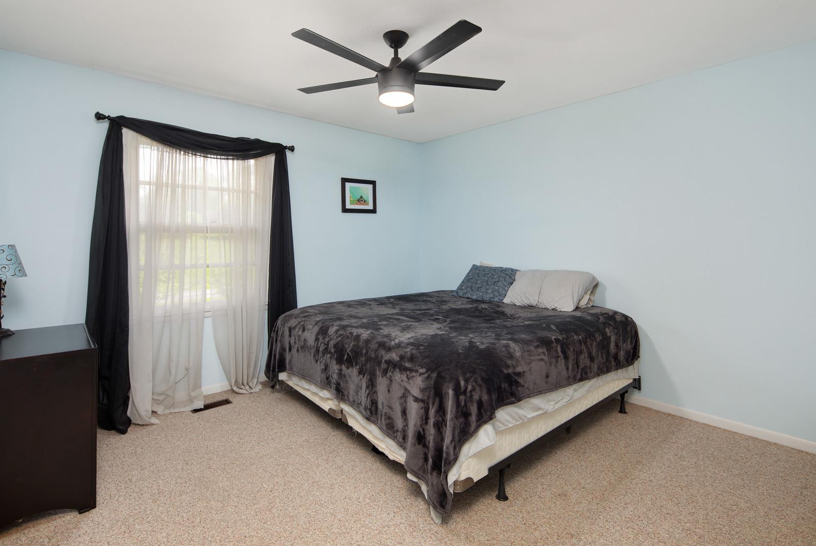 2413 Porter Road Nashville, TN 37206 - Photo 15 of 29 a bedroom with a bed and window
