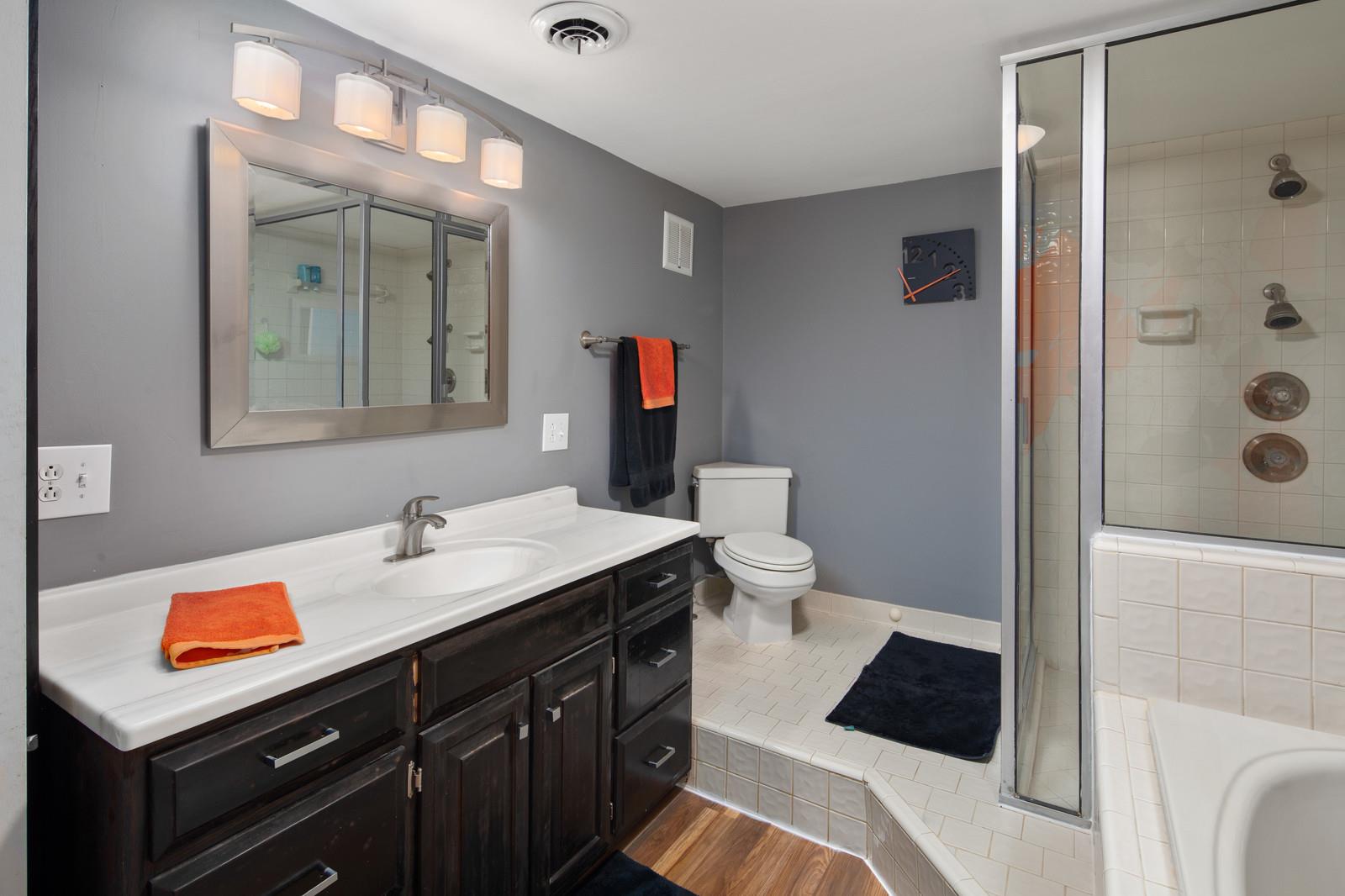 2413 Porter Road Nashville, TN 37206 - Photo 25 of 29 a bathroom with a sink a toilet and shower