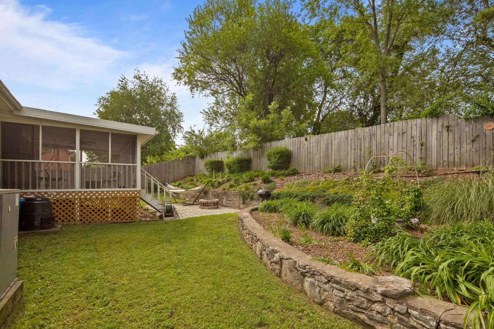 2413 Porter Road Nashville, TN 37206 - Photo 29 of 29 a view of a house with backyard sitting area and garden