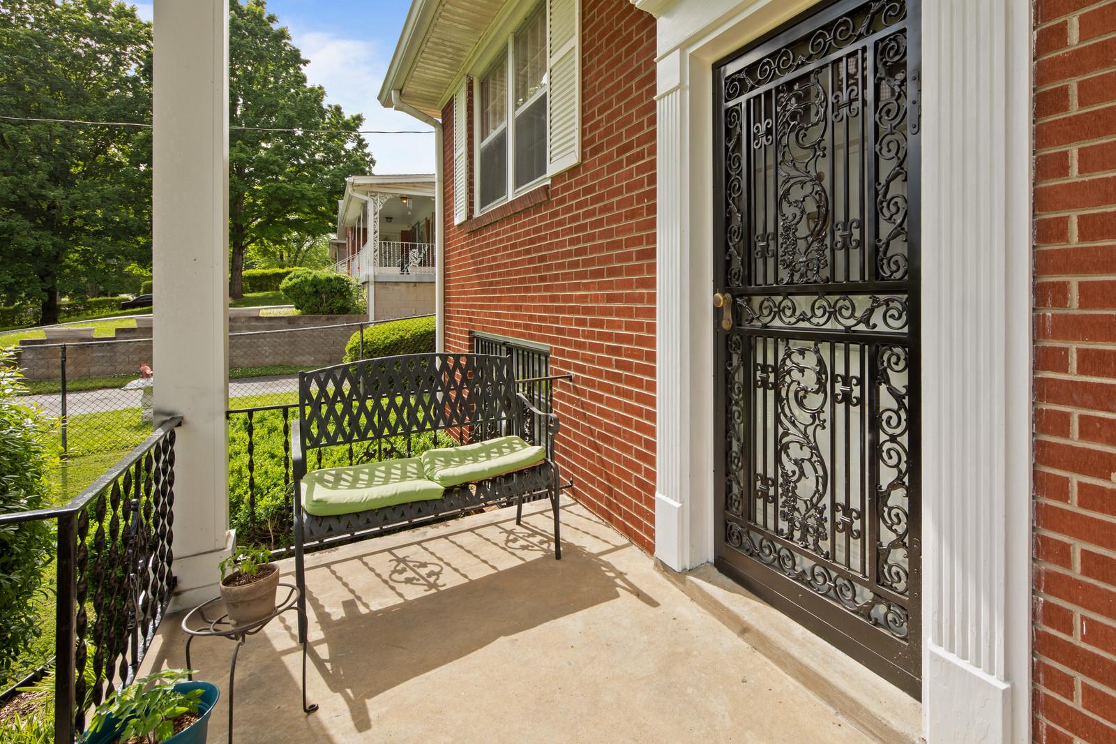 2413 Porter Road Nashville, TN 37206 - Photo 4 of 29 a view of a wooden door with a bench