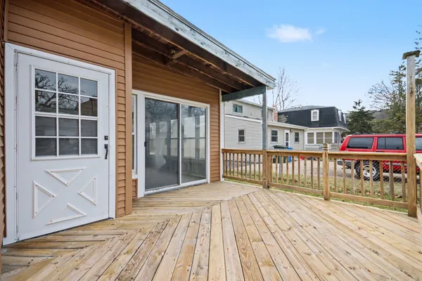a view of a house with wooden deck
