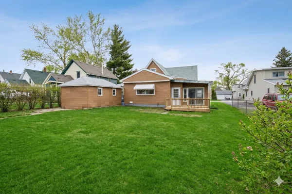 a front view of a house with a garden