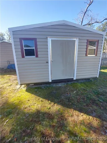 a view of a backyard of the house