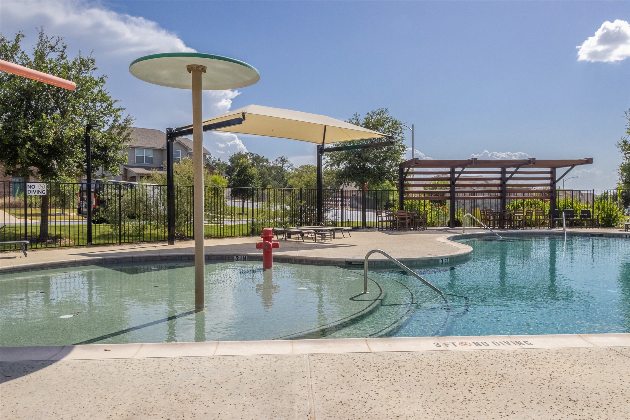7225 Ranchito Drive Austin, TX 78744 - Photo 35 of 39 Enjoy sunny days poolside with a shaded seating area and inviting waters.