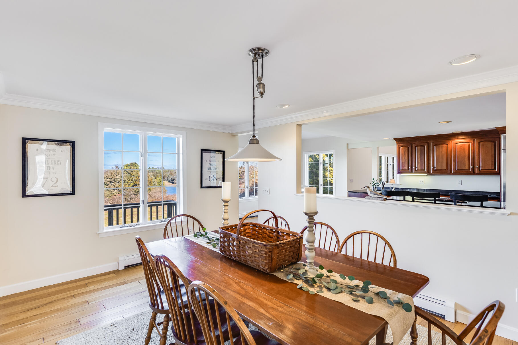 6-12 Snow Way Orleans, MA 02653 - Photo 14 of 42 a view of a a dining room with furniture window and wooden floor