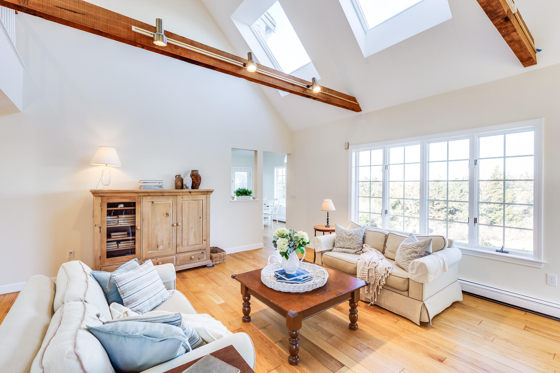 6-12 Snow Way Orleans, MA 02653 - Photo 22 of 42 a living room with furniture and a large window