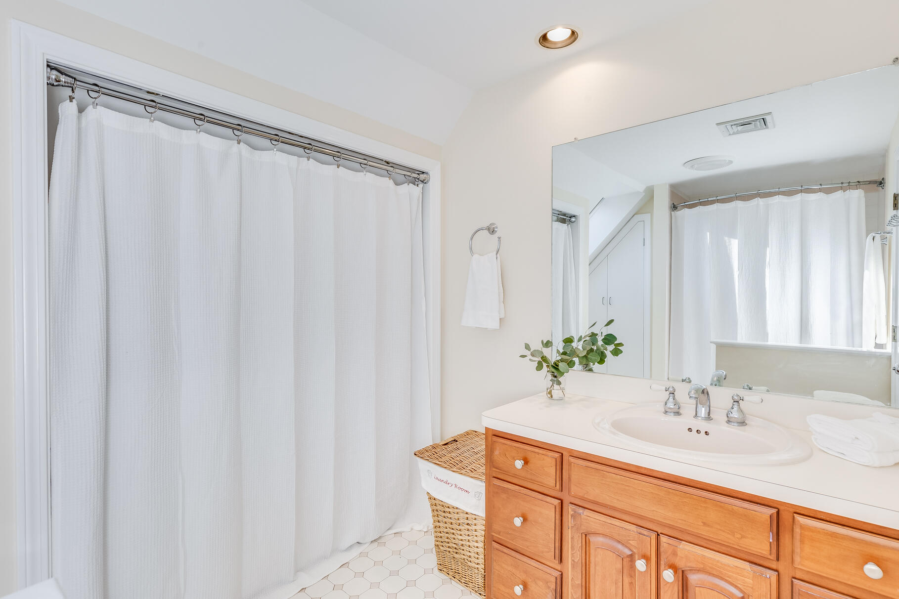 6-12 Snow Way Orleans, MA 02653 - Photo 34 of 42 a bathroom with a granite countertop sink and a mirror