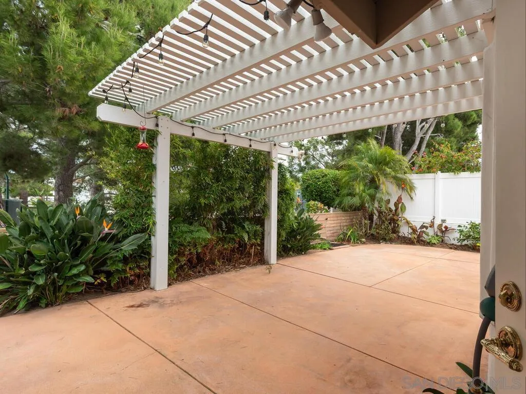 4708 Galicia Way Oceanside, CA 92056 - Photo 15 of 44 a view of a house with porch and a yard