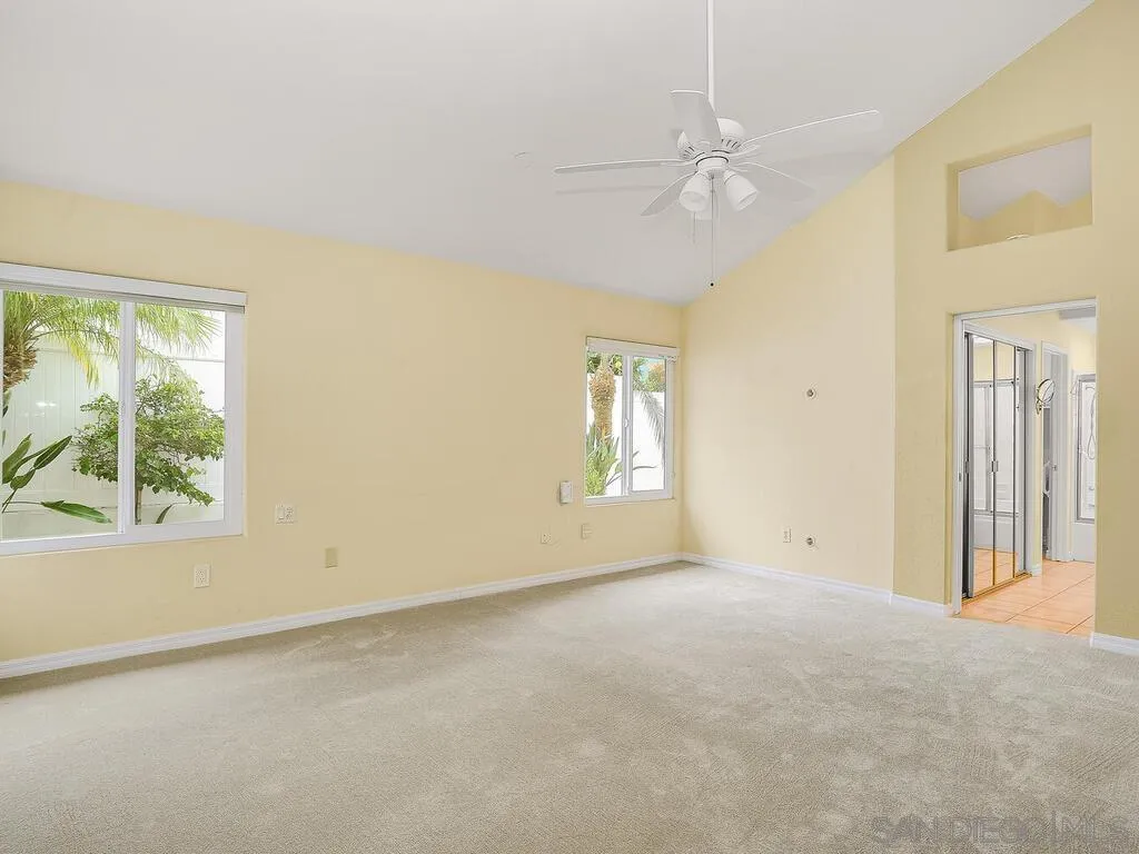 4708 Galicia Way Oceanside, CA 92056 - Photo 20 of 44 an empty room with windows and closet