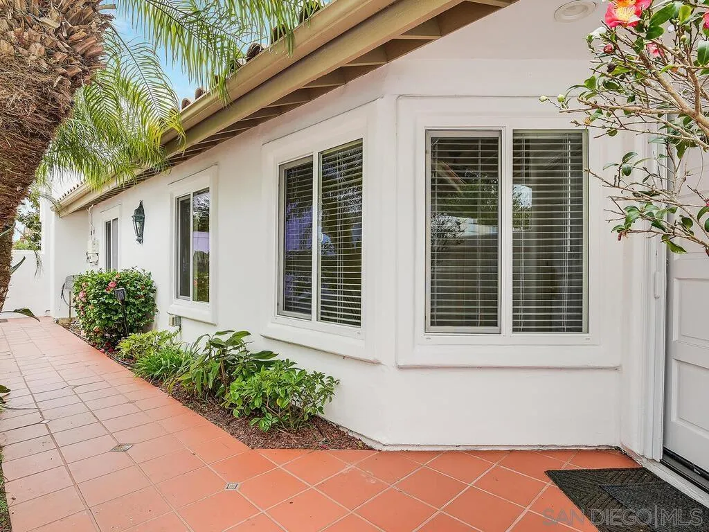 4708 Galicia Way Oceanside, CA 92056 - Photo 2 of 44 a front view of a house with garden