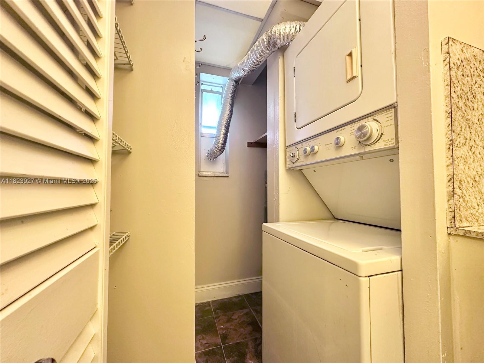 8001 Fairview Drive, Unit 107 Tamarac, FL 33321 - Photo 14 of 33 a utility room with dryer and washer