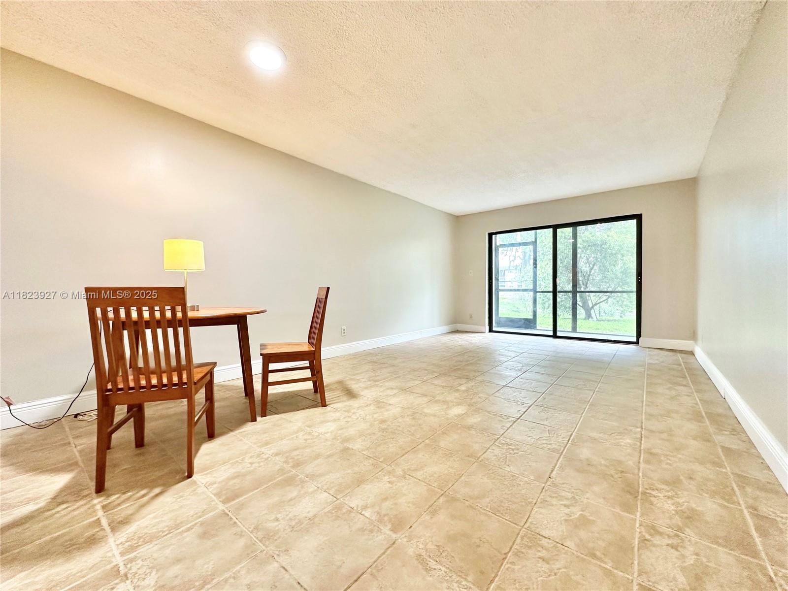 8001 Fairview Drive, Unit 107 Tamarac, FL 33321 - Photo 19 of 33 a view of a livingroom with furniture and a window