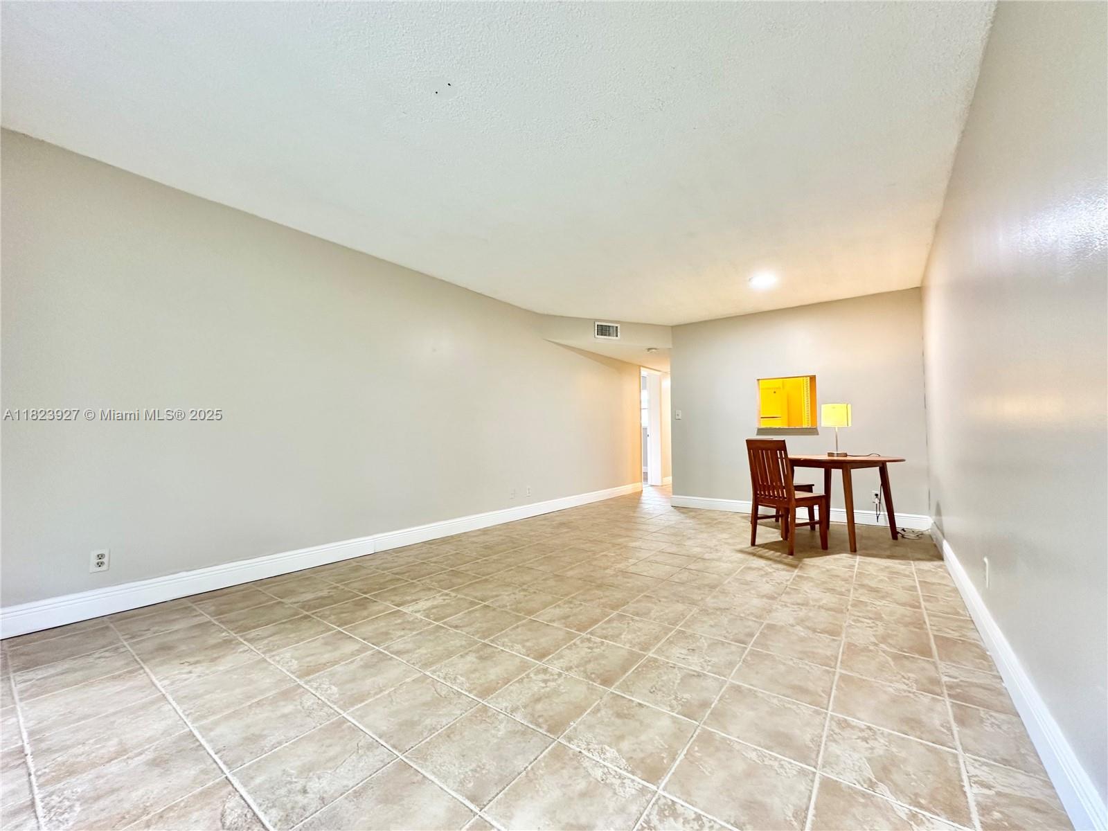 8001 Fairview Drive, Unit 107 Tamarac, FL 33321 - Photo 20 of 33 a view of an empty room