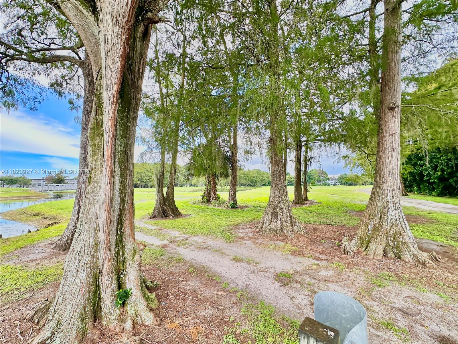 8001 Fairview Drive, Unit 107 Tamarac, FL 33321 - Photo 28 of 33 a view of a yard with swimming pool