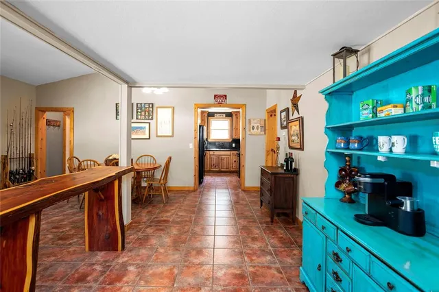 a living room with furniture a rug and a window