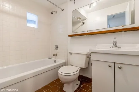 a bathroom with a sink a toilet and a bathtub