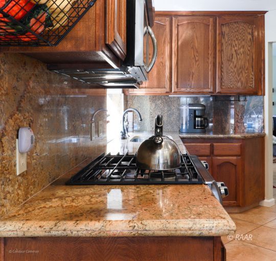 240 West Sequoia Place Ridgecrest, CA 93555 - Photo 12 of 32 a kitchen with a stove and a cabinets