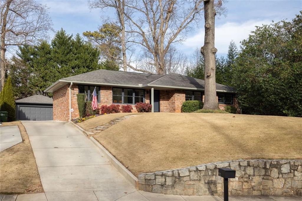 902 Cumberland Road Northeast Atlanta, GA 30306 - Photo 19 of 22 a view of a white house with a large trees