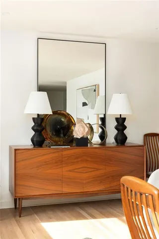 a bedroom with a bed and a lamp