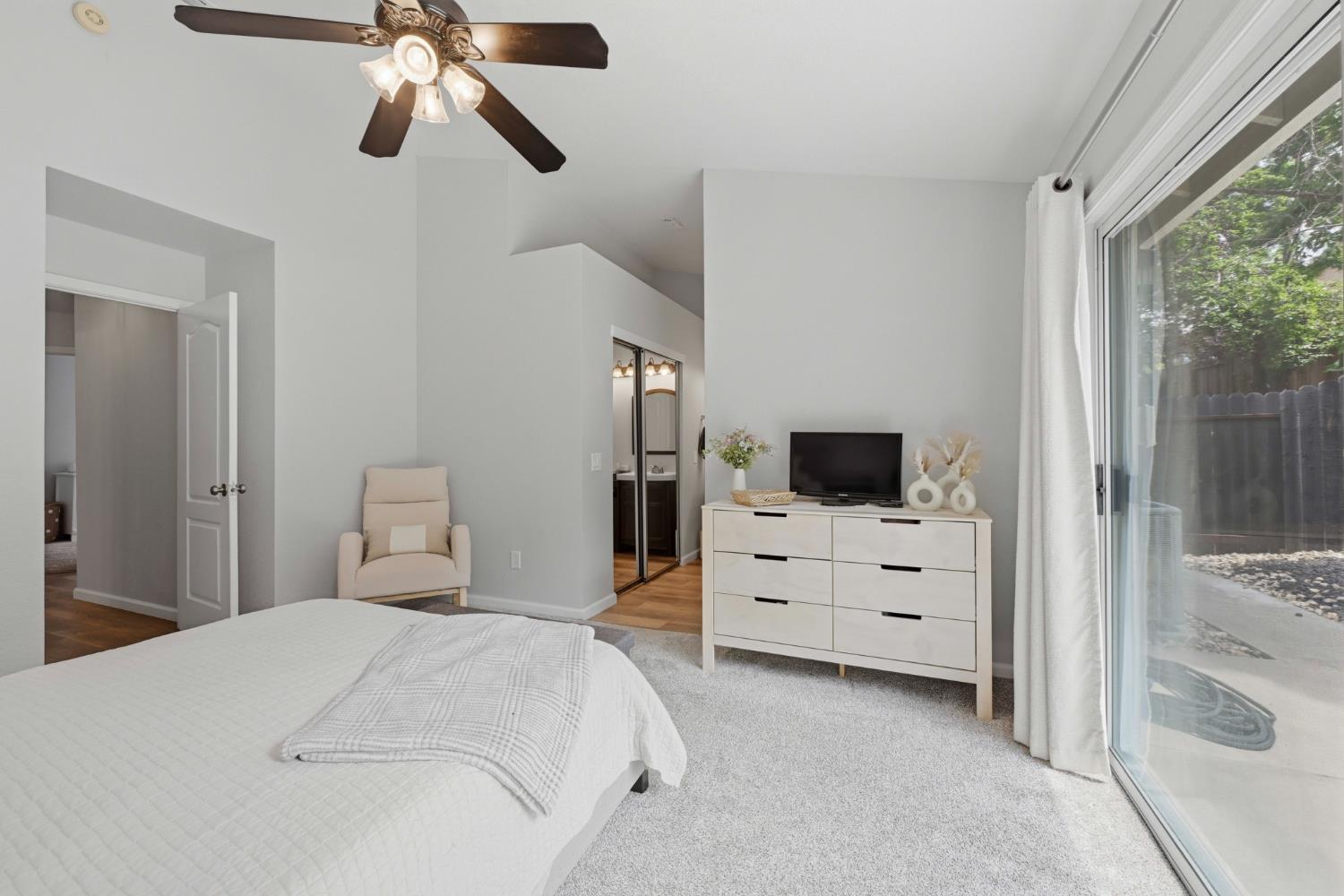 5013 Charter Road Rocklin, CA 95765 - Photo 18 of 35 a bedroom with a bed and a flat screen tv