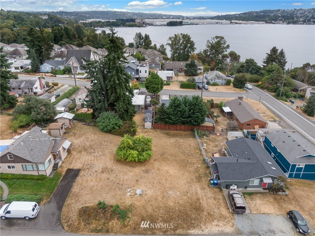 909 North 29th Street Renton, WA 98056 - Photo 3 of 12 an aerial view of a house with a garden and lake view