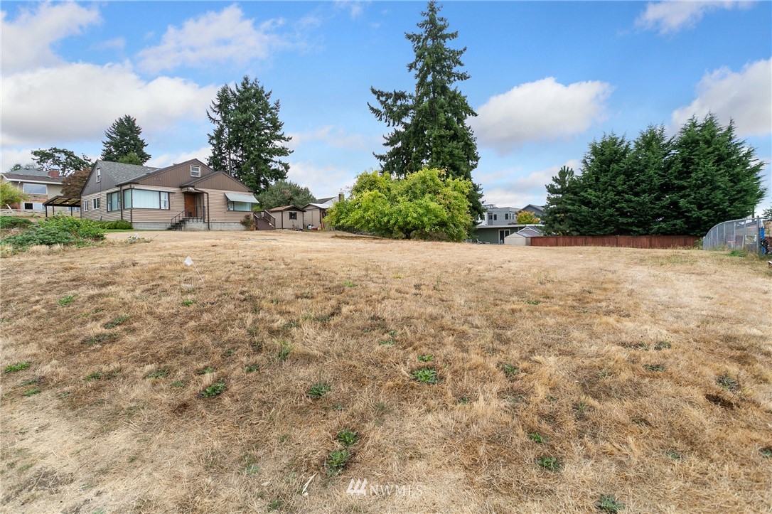 909 North 29th Street Renton, WA 98056 - Photo 8 of 12 a view of a house with a yard and potted plants