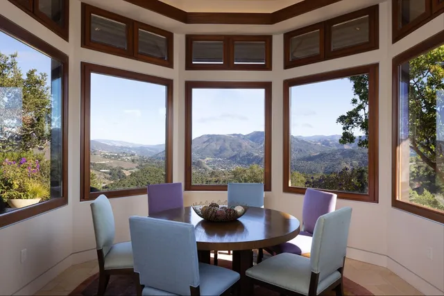 a building outdoor space with patio furniture and potted plants