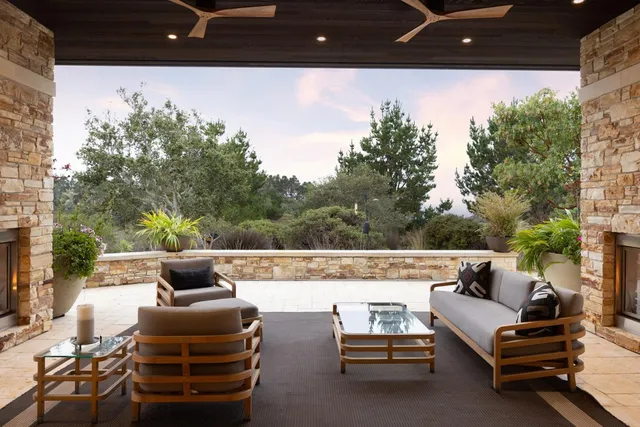 a view of a patio with table and chairs