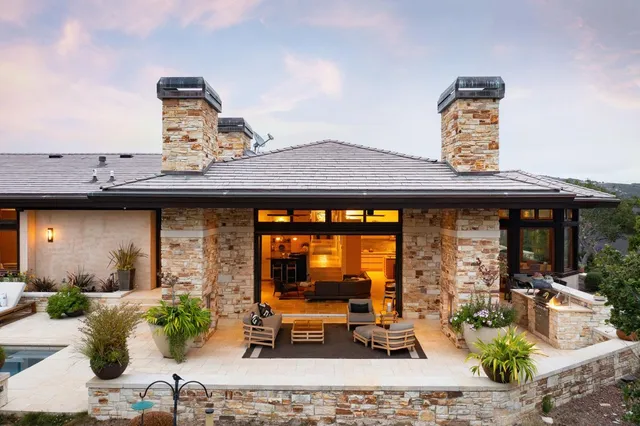 a living room with furniture a rug and a flat screen tv