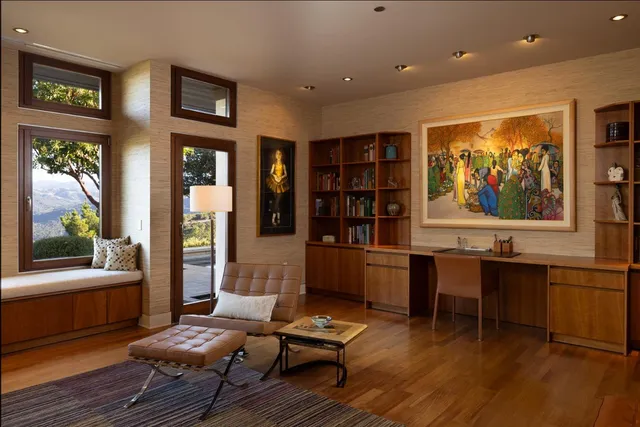 a backyard of a house with barbeque oven table and chairs