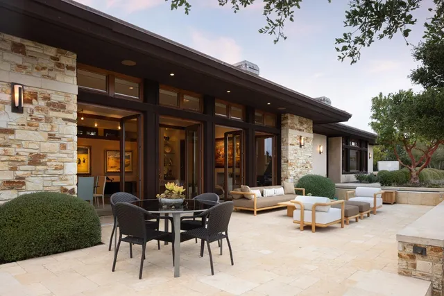 an aerial view of a house with mountain view