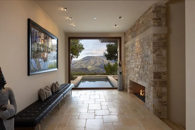 a kitchen with stainless steel appliances granite countertop a sink and a refrigerator